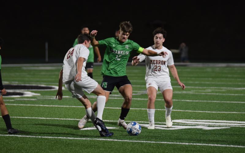Lion Max Bridges splits defenders during action against Hebron Christian Thursday at Jeff Davis Field at Ed Bryant Stadium. (Photos by Scoggins)