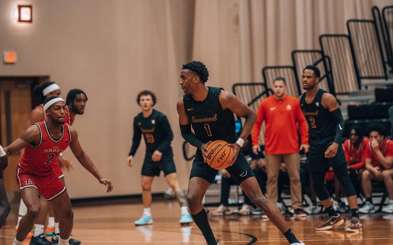 K.J. Jones’ name will be in the Emmanuel University basketball record book for a long time, but Jones will also graduate magna cum laude with a business degree. (Photos courtesy of Emmanuel University)