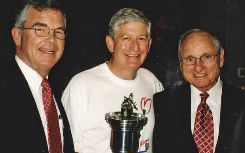 As chairman of Athens 96, top left, I worked with 28 volunteers to coordinate the community’s involvement in the Games. Top right, my leg of the torch run was in Stephens County. To celebrate the 10th anniversary of the 1996 Olympics, the Athens torch run was re-enacted. Above, I’m with Billy Payne, left, and former UGA football coach and athletic director Vince Dooley at the anniversary celebration.
