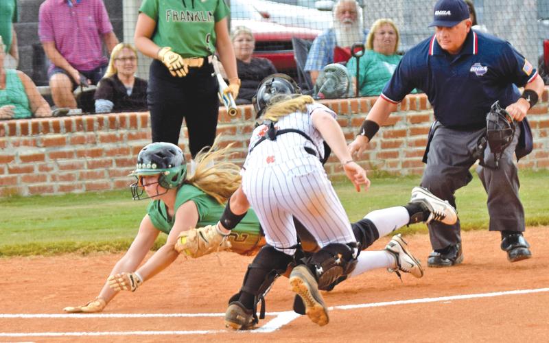 Senior Lenox Roberts (above) slides into home against Hart County last year.