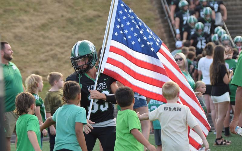 The Franklin County Lions opened the 2024 football season Friday with a close 27-21 loss to Chestatee at Jeff Davis Field at Ed Bryant Stadium. The game began with the recognition of football players and cheerleaders from the Franklin County Recreation Department, who lined up to welcome Keyes Harbin (No. 33) and his Lion teammates.
