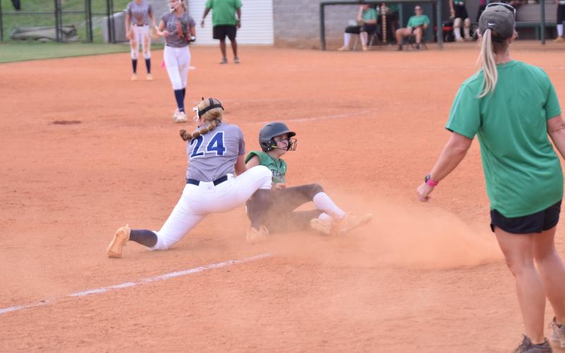 Macy Moore slides safely into third base Monday in a win over Elbert in Carnesville. (Photo by Scoggins)