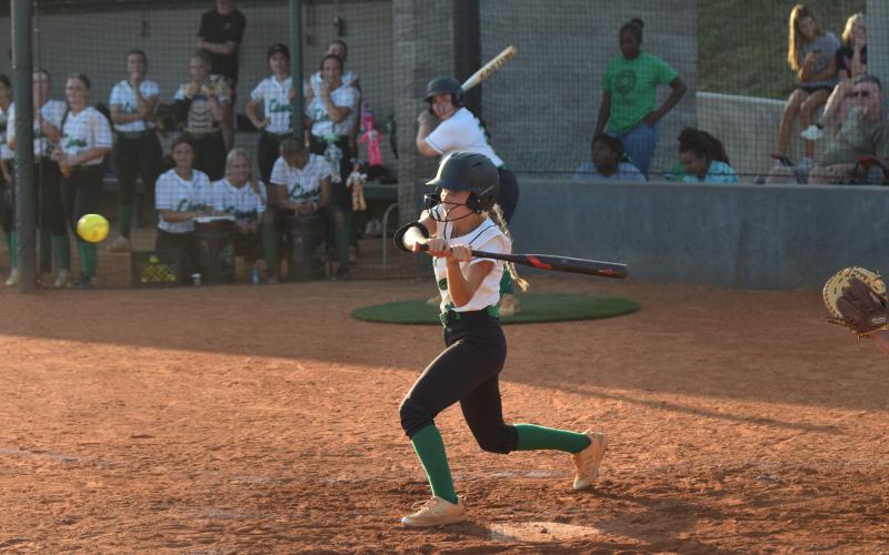 Josie Burton (above) prepares to swing in a Region 8AA victory over East Jackson Tuesday in Carnesville.
