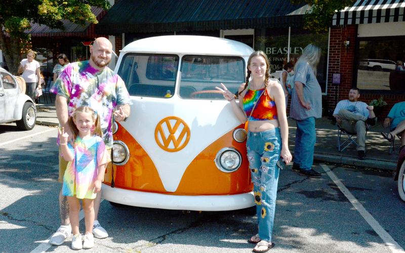 Flashing the peace sign in front of a very rare Volkswagen pickup truck are Scott Seward, Lily Seward and Bridget Cobb.