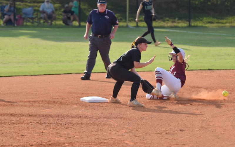 Lady Lion shortstop Hayden McGee takes a throw to second as a Hebron Christian runner steals second during Tuesday’s Region 8AA contest in Carnesville. (Photo by Scoggins)