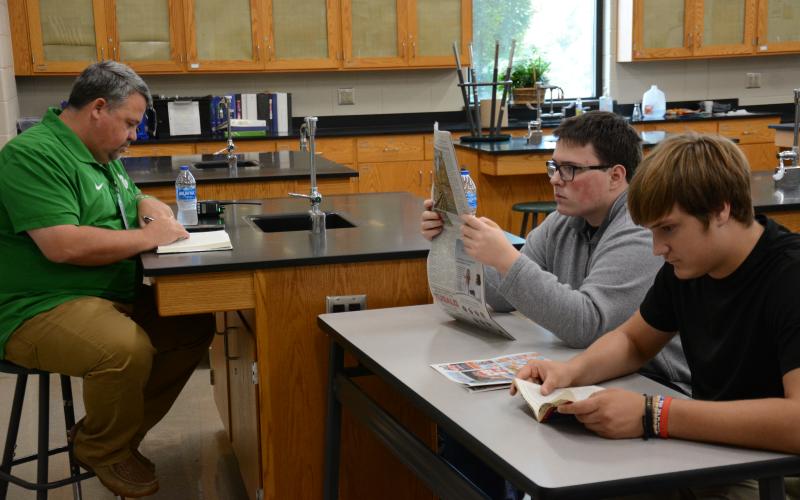 Franklin County High School Principal Matt Stowers (left) joins students in reading for 20 minutes a day, four days a week at FCHS. (Photo by Eavenson)