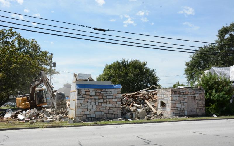 LAVONIA – A contractor for the City of Lavonia demolished the city-owned Ford Theatre building on Vickery Street Tuesday. Most recently, the old rock building had housed Lavonia Masonic Lodge No. 241. Mayor Courtney Umbehant said that plans are under way to expand the Downtown Weldon Park where the gazebo is located. (Photo by Eavenson)