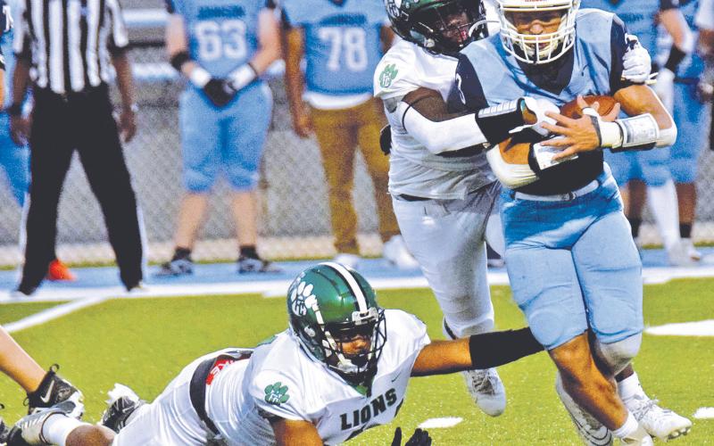 The Franklin County Lion defense, pictured in action against Johnson of Gainesville earlier this season, will look to hold down a powerful Prince Avenue Wolverines team Friday night in Bogart.