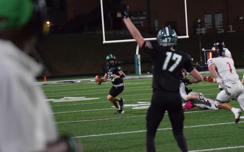 Keyes Harbin looks for a receiver as Everett Allegood signals he is open during Friday's game against Hebron Christian.