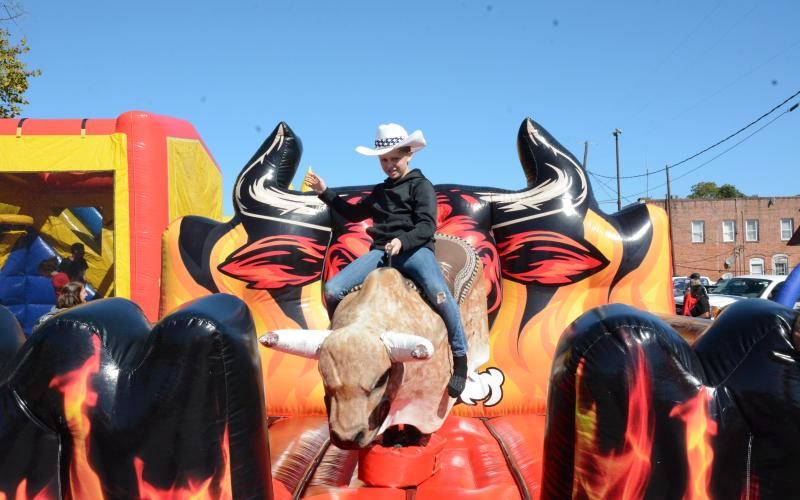Trenton Sorrows brought his cowboy hat and jeans to take on a bucking bull Saturday at the Royston Fall Festival.