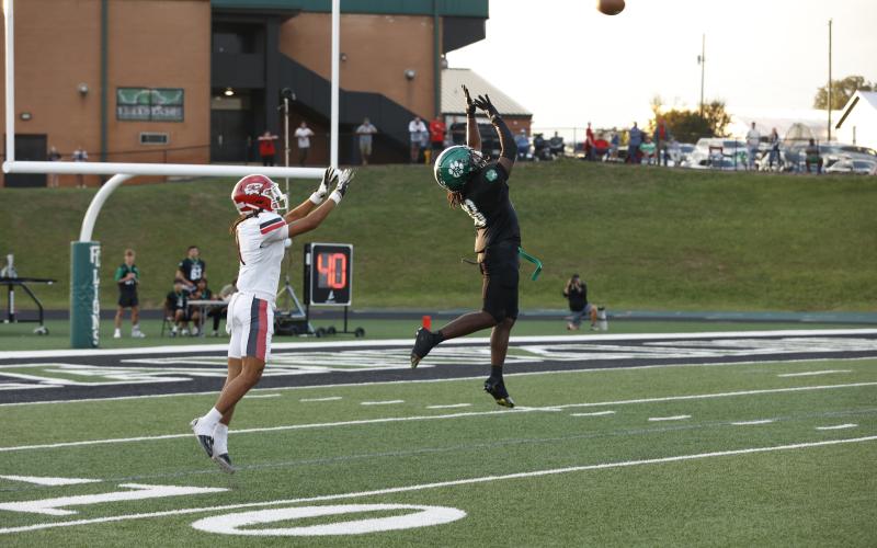 Jeremiah Mayfield (top photo) leaps to defend a pass during Monday’s game against Stephens County in Carnesville. (Photo courtesy of Rachel Howington Photography)