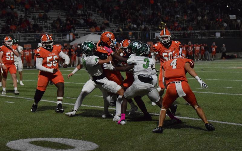 Franklin defenders Myles Kelley and Carmelo Hines brings down a Hart runner in action Friday in Hartwell. (Photo by Scoggins)
