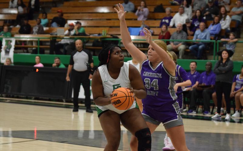 Ta’Kiyah Merriett looks for a shot in the season-opener Tuesday against Cherokee Bluff. (Photo by Scoggins)
