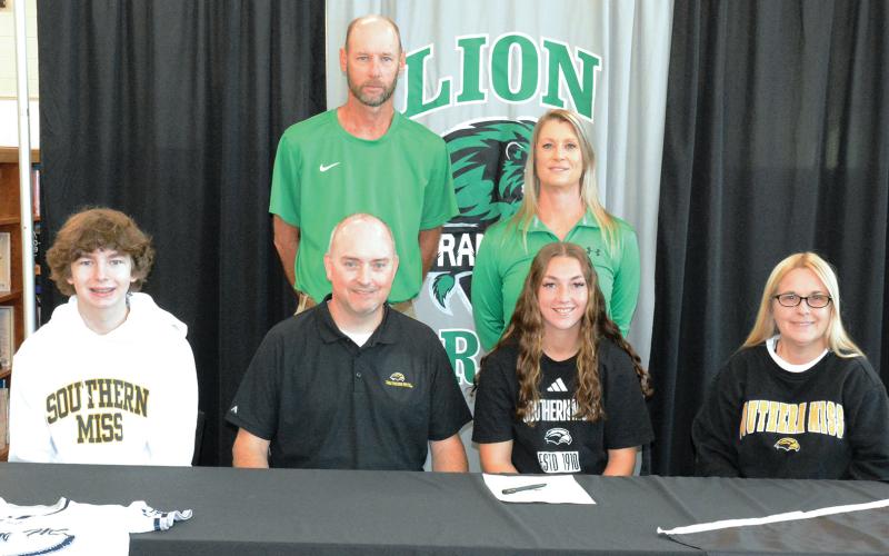 FCHS senior McCall Davis signed a scholarship offer from the University of Southern Mississippi Nov. 13 at the high school. Attending the ceremony were her family members (seated from left), Ryker, Kevin, McCall and Paula Davis and her coaches (back, from left) Tim Cawthon and Head Coach Cherokee Bell. (Photo by Eavenson)