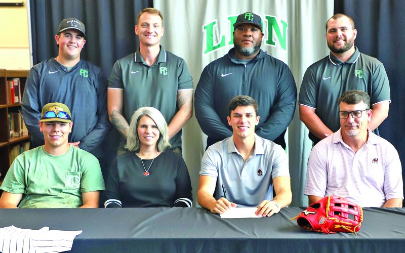 Franklin County Lion senior Ty Peeples signed Friday to play for the Georgia Bulldogs’ baseball team next year. Pictured at his signing are (front, from left) brother A.J. Peeples, mom Kim Peeples, Ty, dad Tod Peeples, (back) Lion baseball coaches Duncan Beasley, Drew Phillip, Demond Rivers and head coach Ryan Phillips.