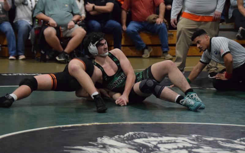 Lion Nate Stratton works to pin a Hart County opponent Tuesday in Carnesville. (Photo by Scoggins)