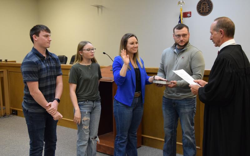 Probate Judge Ken Eavenson administered the oaths of office to newly-elected members of the Franklin County Board of Commissioners Monday. Taking the oath were incoming Commission Chairman Courtney Long (right photo), who was joined by husband Jeremy and children Nathan and Sidney; new District 2 Commissioner Cory Pulliam (below left photo), who was joined by wife Carrie; and new District 1 Commissioner Wanda Thompson (below right photo), who was joined by husband Stephen. The new commissioners will officia