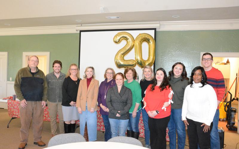 Harmony House staff and board members attending Thursday’s 20th anniversary celebration were (from left) James Williams, Walker Rice, Regina Hooper, Laurie Whitworth, Wendy Risner, Kayla Farmer, Sydney Jordan, Jennifer Rainer, Kaitlin Andrews, Olivia Owensby, Kimberly Brewer and Darrin Haley.  (Photo by Eavenson)