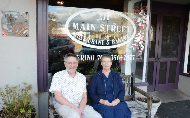 211 Main Street Restaurant founders Bob and Trish Toews have sold the cornerstone business in downtown Lavonia to Top Dawg Grillers owners Chris and Kim Rice. (Photo by Eavenson)