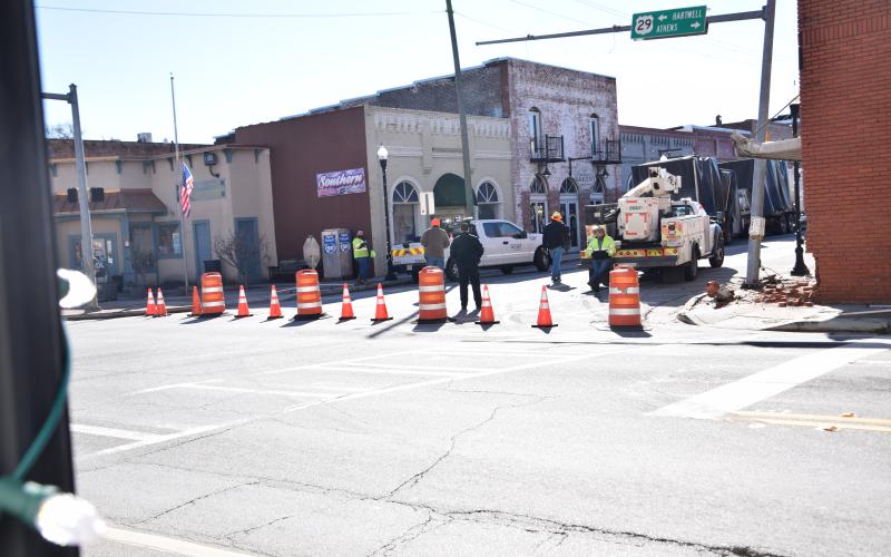 Highway 17 was blocked off for part of Monday at the intersection with U.S. Highway 29 after a tractor-trailer attempted to make a turn and damaged a building, traffic signal pole and fire hydrant. (Photo by Scoggins)