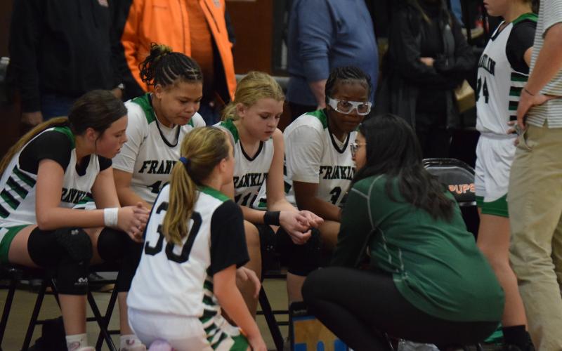 Coach Tykia Thompson gives instructions to eighth grade Lady Cubs (right photo, from left) Allie Duncan, Baylor King, Keiko Niccum, Elleigh Grizzle and Jyhia Sturghill.