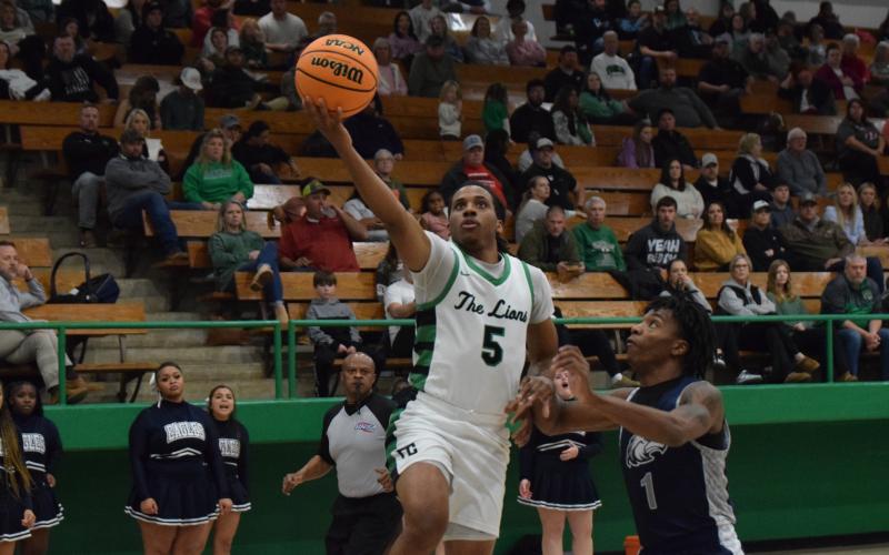 Frae’Quane Wilkins goes up for a layup during the Franklin County Lions’ victory Friday over East Jackson in the Lion’s Den. (Photo by Scoggins)