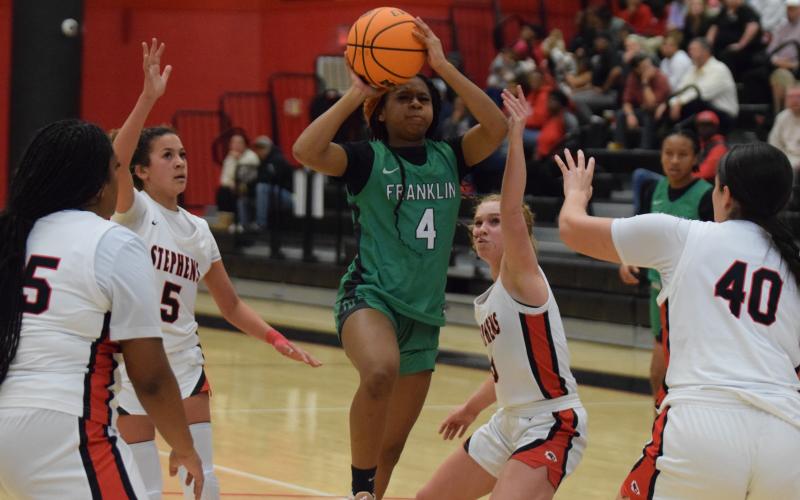 Nykhia Johnson puts up a shot against Stephens County Tuesday in Toccoa. Johnson finished with 20 points to lead the Franklin County Lady Lions.