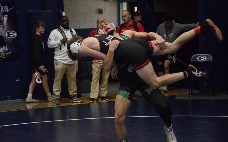 Franklin County Lion Josh Baughcum picks up an opponent for a takedown during action Saturday in the Inferno Invitational in Elberton. (Photo by Scoggins)