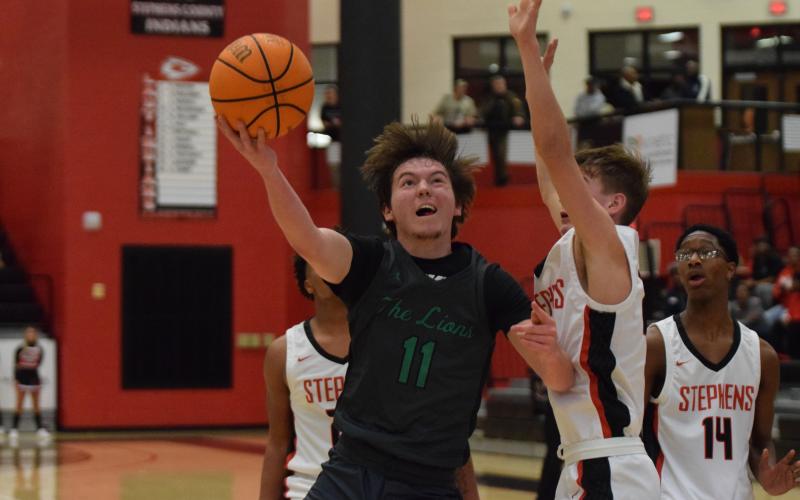 Bentley Huff (above) puts up a shot Tuesday against Stephens County.