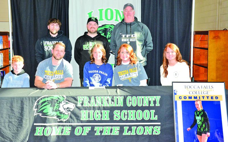 Pictured at a scholarship signing for Hartley Brannon with Toccoa Falls College are (front, from left) brother Harrison Brannon, father Matt Brannon, Hartley, mother Jessica Brannon, sister Hayden Brannon, (back) FCHS assistant girls’ soccer coach Chandler Childs, head coach Connor Irvin and Toccoa Falls women’s soccer head coach John Drouse. (Photo by Eavenson)