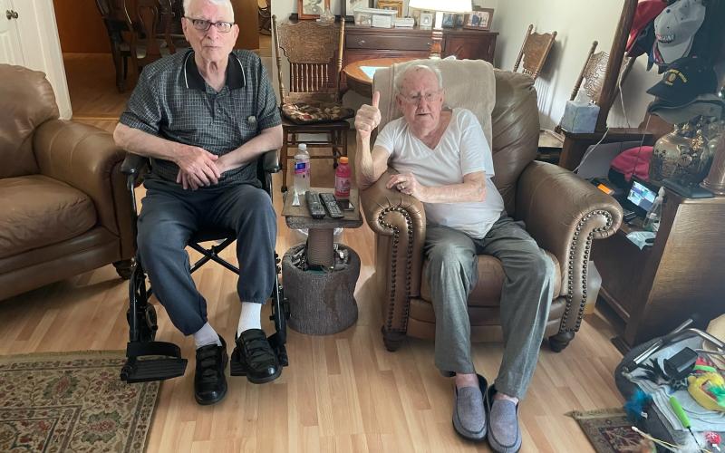 Tommy Cole of Lavonia (right) visits with his old Army buddy, Ron Burdette. The two served together in Korea and still communicate regularly.