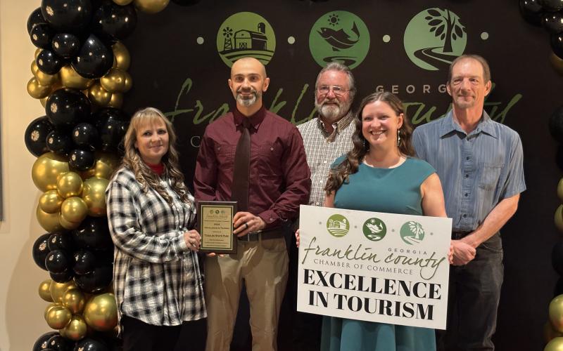 Tugaloo State Park in Lavonia was presented an Excellence in Tourism Award at the Franklin County Chamber of Commerce Gala and Awards Banquet Thursday at the Swails Center. Accepting the award were (above, from left) Housekeeper Supervisor Ann Gainous, Park Manager Josh Purdy, General Trades Technician Luke Burdette, Assistant Park Manager Tracy Brooks and Senior Maintenance Ranger  Robert Jones.