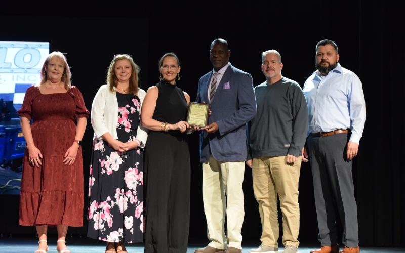 Accepting the award for Industry of the Year presented to Fanello Industries by Franklin County Chamber of Commerce Executive Director Rachel Howington (center) are (from left) Jamie Mitchell, Patty Mosley, Rico Daniel, Bryan Moorhead and Orlando Orona.