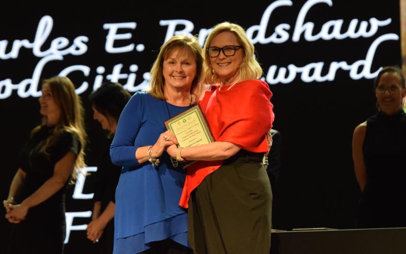 Debbie Flowers (left) was presented the Charles E. Bradshaw Good Citizen Award by Franklin County Chamber of Commerce President Cyndee Phillips during the chamber’s Gala and Awards Thursday at the Swails Center. (Photo by Scoggins)