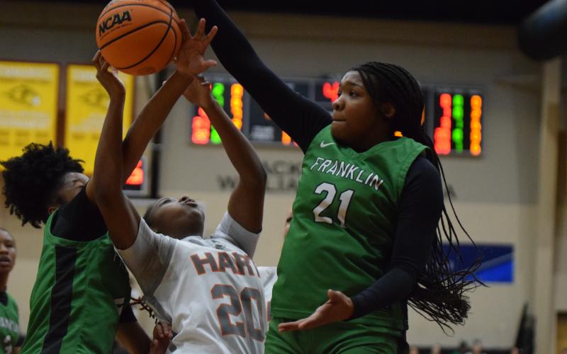 Lady Lion Roniyah Johnson blocks a Hart County shot during the Region 8AA semifinals last week at Emmanuel University. (Photo by Scoggins)