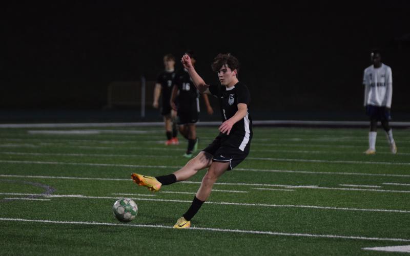 Midfielder Reese Fowler takes a free kick in a game earlier this season for the Franklin County Lions.