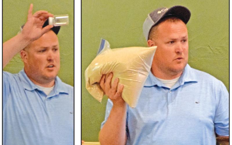 Franklin Springs wastewater operator Brandon Fitzgerald holds up a small vial (left photo) to show the amount of pollution left in treated wastewater that is discharged and runs in to the Broad River, versus the amount of pollution found in the river itself (right photo).