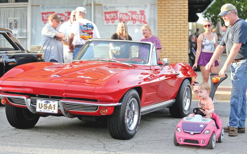 ROYSTON – Cut A Block Friday in Royston turned out to be a great time for car lovers of all ages and man’s best friend too. The second annual event drew a large crowd to downtown Royston for a night of classic cars, memories and good music, including the christening of the new concert stage at The Royce, by singer Aaron Tanner. For more photos and information on the event, see Page 16. (Photos by Rose Scoggins)