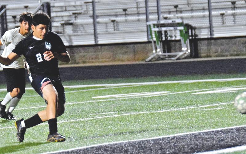 Senior Lion Christian Guerrero sends a penalty kick into the net for one of Franklin County’s goals in a 4-2 win over Hart County Friday night at Jeff Davis Field at Ed Bryant Stadium. Franklin’s win over Hart County, combined with a Hart loss Tuesday to Hebron Christian, means Franklin will finish second in the region and host a state playoff game for the first time ever. (Photos by Scoggins)