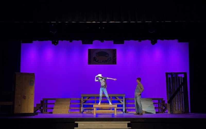 Brock Fowler (left), as Ren, dances as Taylor Haley, as Willard, watches in a scene from “Footloose, The Musical,” which will be on stage at the Telford Center for the Fine and Performing Arts beginning tonight.