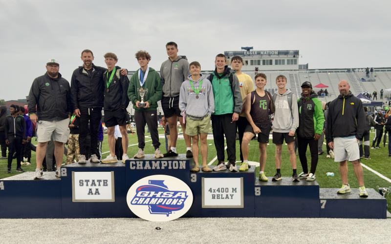 The Franklin County boys’ track team (top photo) placed second in the Class AA state meet. (Photo courtesy of Franklin County Track)