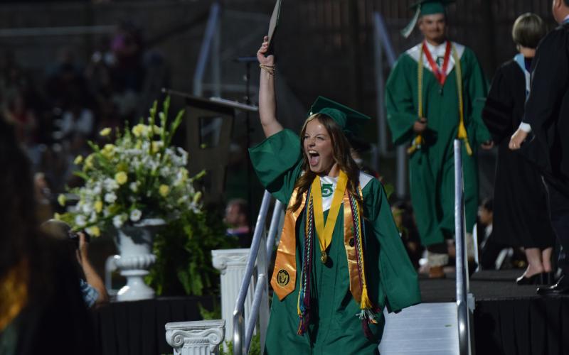 CARNESVILLE – Franklin County High School Class of 2025 salutatorian Kayla Parker celebrates Friday after walking off the stage from receiving her high school diploma during FCHS’ 61st annual Commencement Exercise at Jeff Davis Field at Ed Bryant Stadium. Parker and 236 classmates were awarded diplomas during the ceremony. For more photos from graduation, see Pages 6-7A. (Photo by Scoggins)