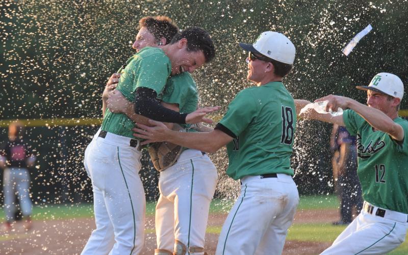 Franklin County Lions Ty Peeples, Will Dodd, Colby Cape and Eli Moore (above) celebrate after the team defeated No. 1-ranked Morgan County on the road last week in the state semifinals.
