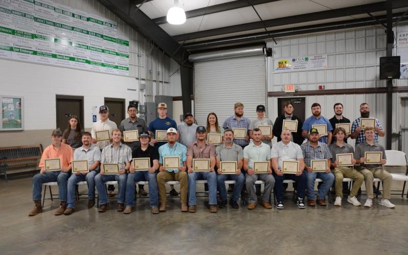 New firefighters graduating (above) from Firefighter 1 training Thursday at the Franklin County High School Ag Building are (seated, from left): Connor Anderson, Jeremey Barnes, Landon Bentley, Hunter Bruce, Landon Bruce, Preston Chandler, Joe Cheek, Brandon Coleman, Dennis Dailey, Mark Edwards, Landon Floyd, Rhett Floyd, (second row) Katie Free, Caden Jordan, Rusty King, Elijah London, James Roberts, Kayla Rogers, Ben Roper, Mallory Segars, Sam Segars, Parker Sosby, T.J. Sosby and Chris Williamson. Not pic