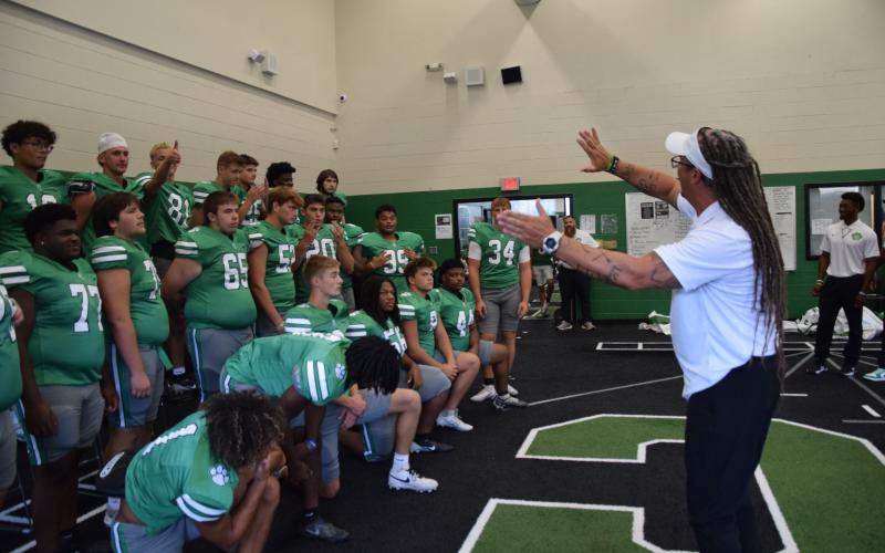 Coach Chuck Holland lines up his 2025 Franklin County Lion football team Tuesday during Picture Day at Franklin County High School.