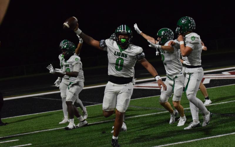 Senior D.J. Appleby comes up with a recovered fumble to end Friday night’s season opener in overtime, securing a 14-7 Franklin County Lion win over Chestatee. (Photos by Shane Scoggins)