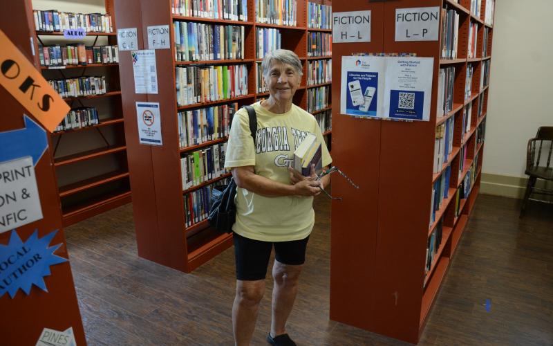 Barbara Meredith, who just recently moved to the area, was making her very first visit to the Lavonia-Carnegie Library when she overheard talk of reduced hours of operation beginning in September. (Photos by Charlie Eavenson)