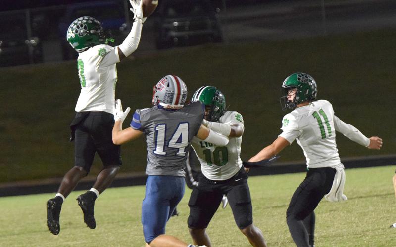 Jeremiah Mayfield leaps for an interception that he would return 65 yards for a touchdown against West-Oak Friday in Westminster, S.C. (Photos by Shane Scoggins)