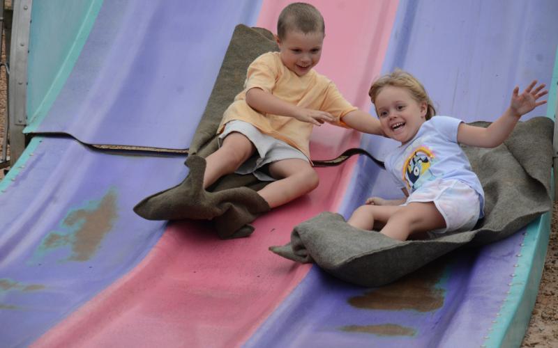 Trent and Tenley Barrett (above photo) enjoyed their trip down the giant slide at the Community Fair in Lavonia this past weekend.