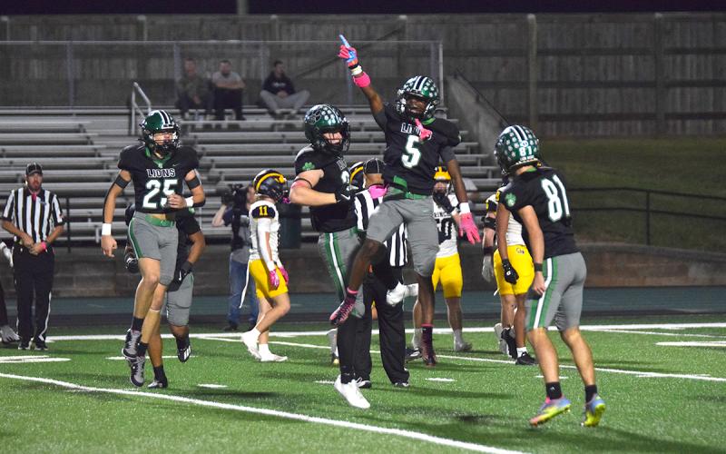 Gavin Wells celebrates after recovering a fumble on a punt for the Franklin County Lions against Prince Avenue. (Photo by Shane Scoggins)